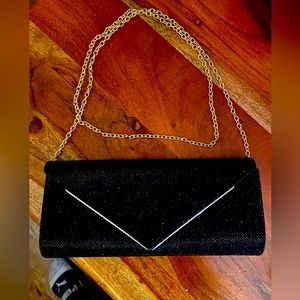 Dazzle and Delight: Black Shimmery Clutch with Removable Chain Strap in Gold and